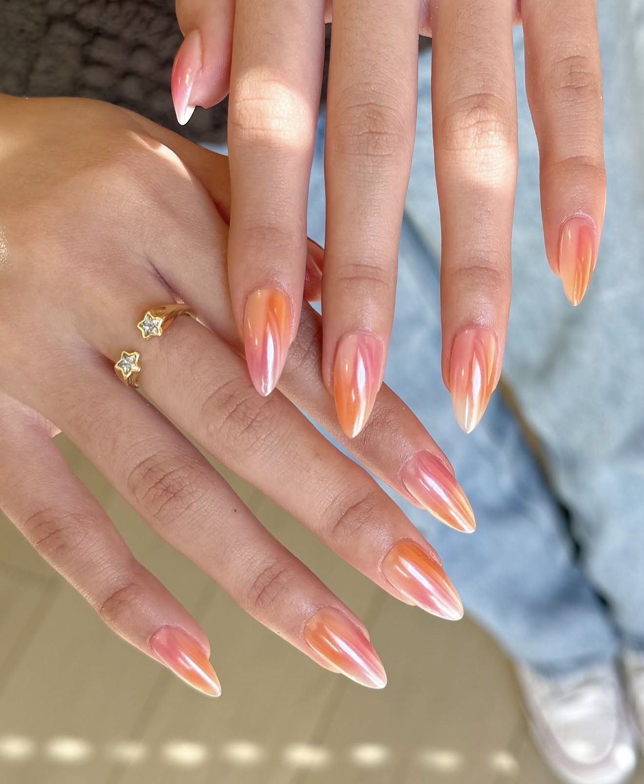Shimmering Peach and Pink Aura Almond Nails