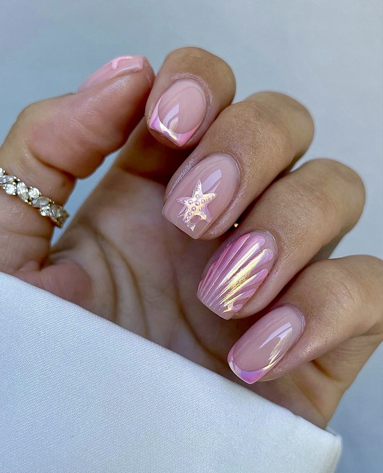 Shimmering Pink Seashell French Tips with Star Accent