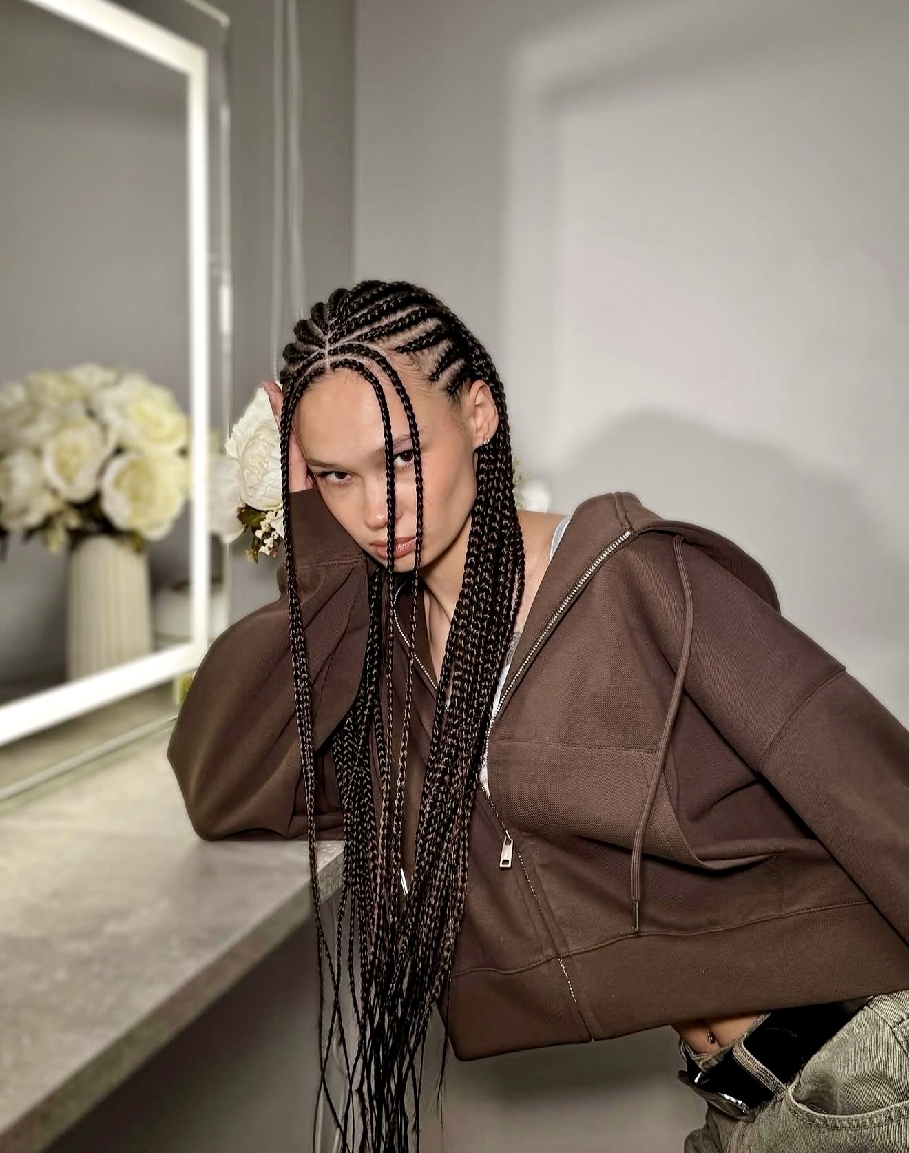 Sleek Braided Cornrows With A Deep Side Part