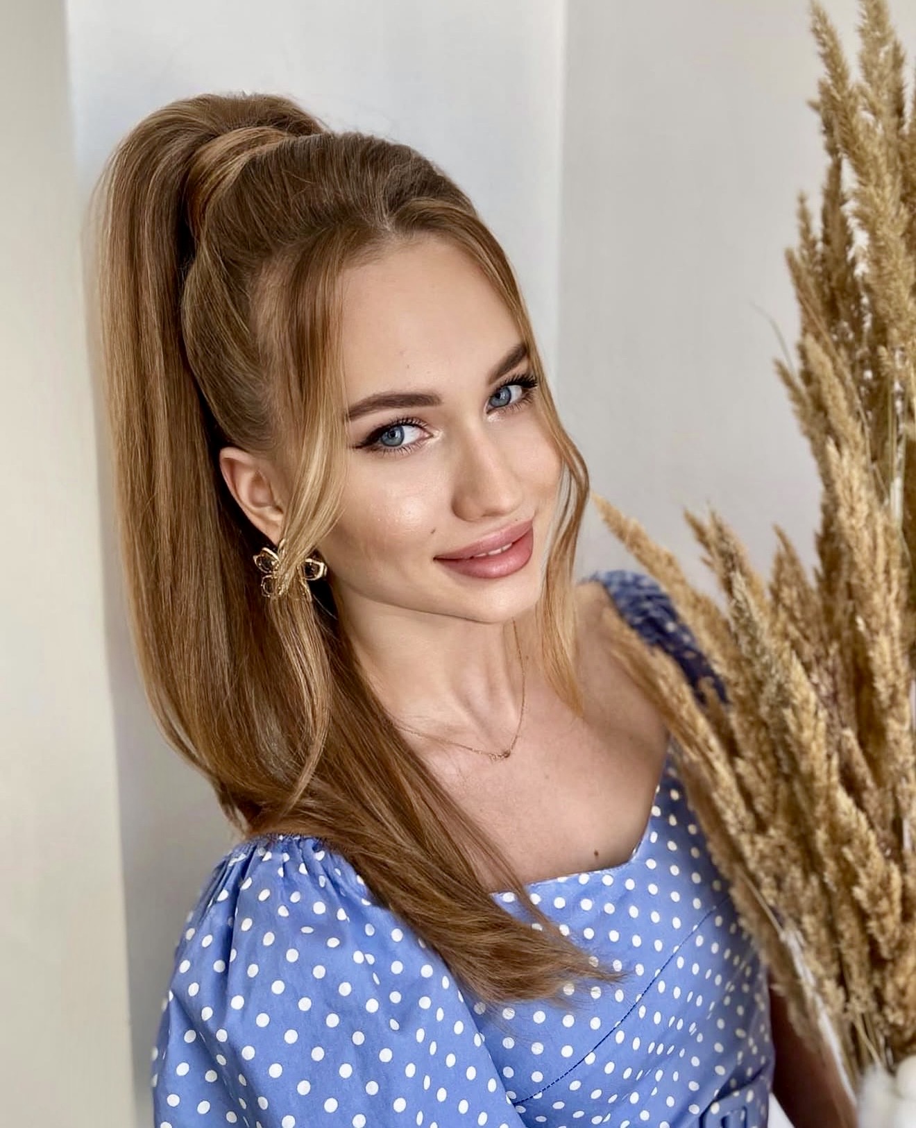 Sleek High Ponytail With Voluminous Face-Framing Layers