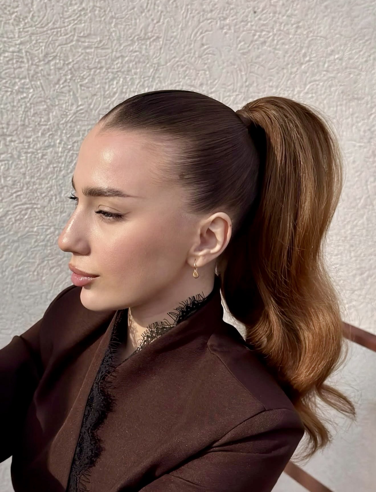 Sleek High Ponytail With Voluminous Waves