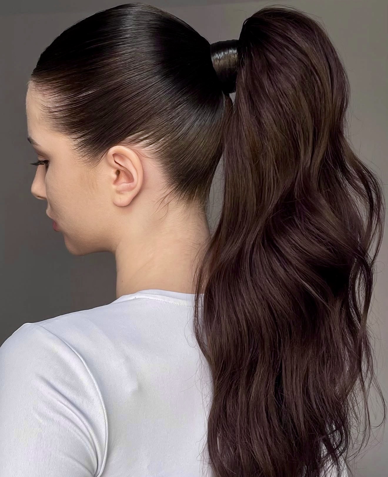 Sleek High Ponytail With Voluminous Waves