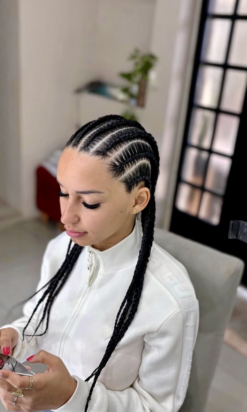 Sleek Middle Part Cornrows With Long Braids