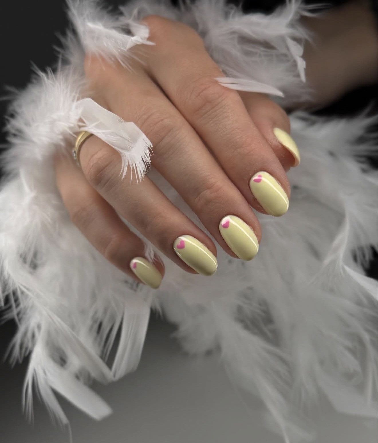 Soft Butter Yellow Oval Nails With Pink Heart Detail