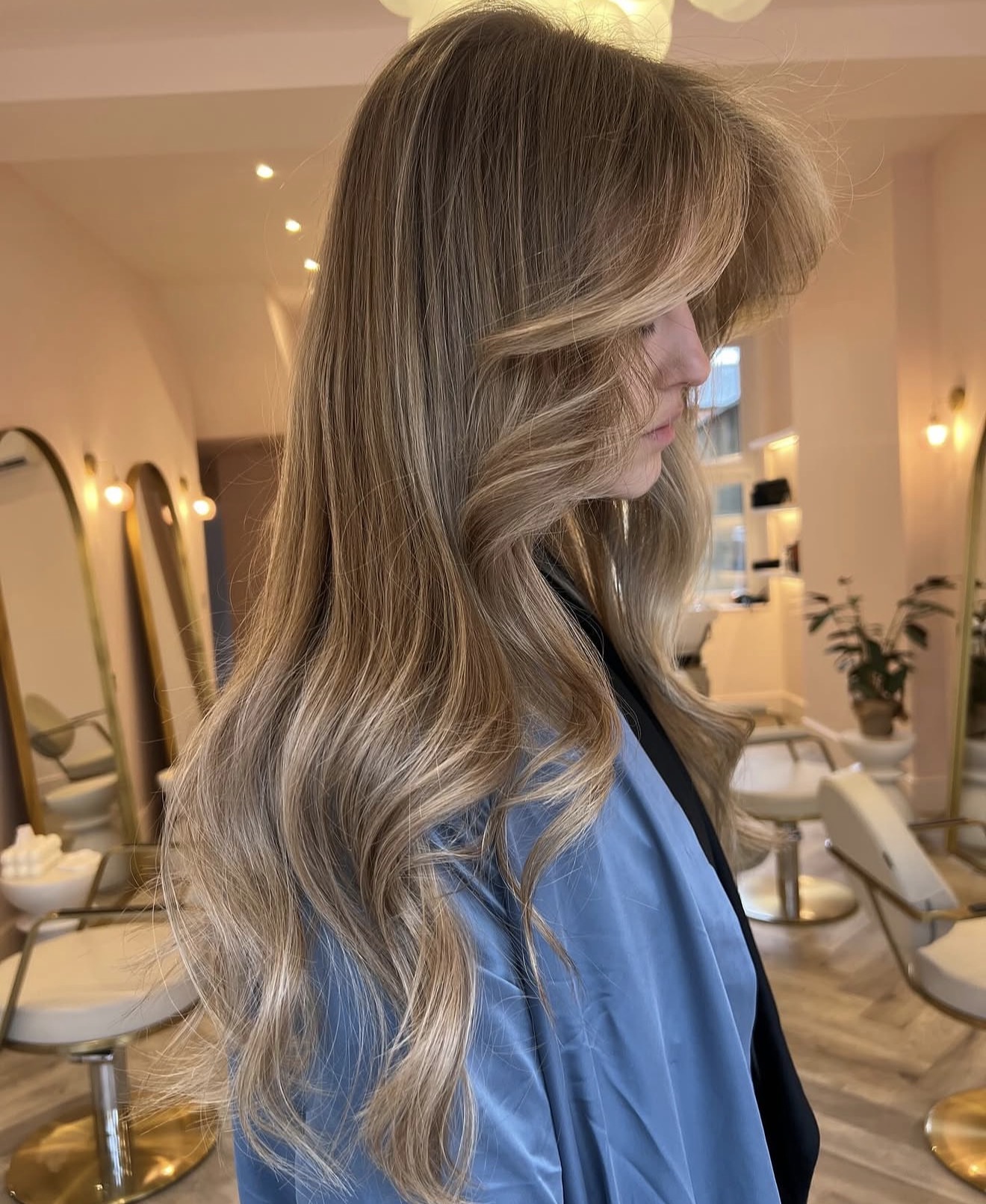 Soft Dirty Blonde Waves With Face-Framing Layers