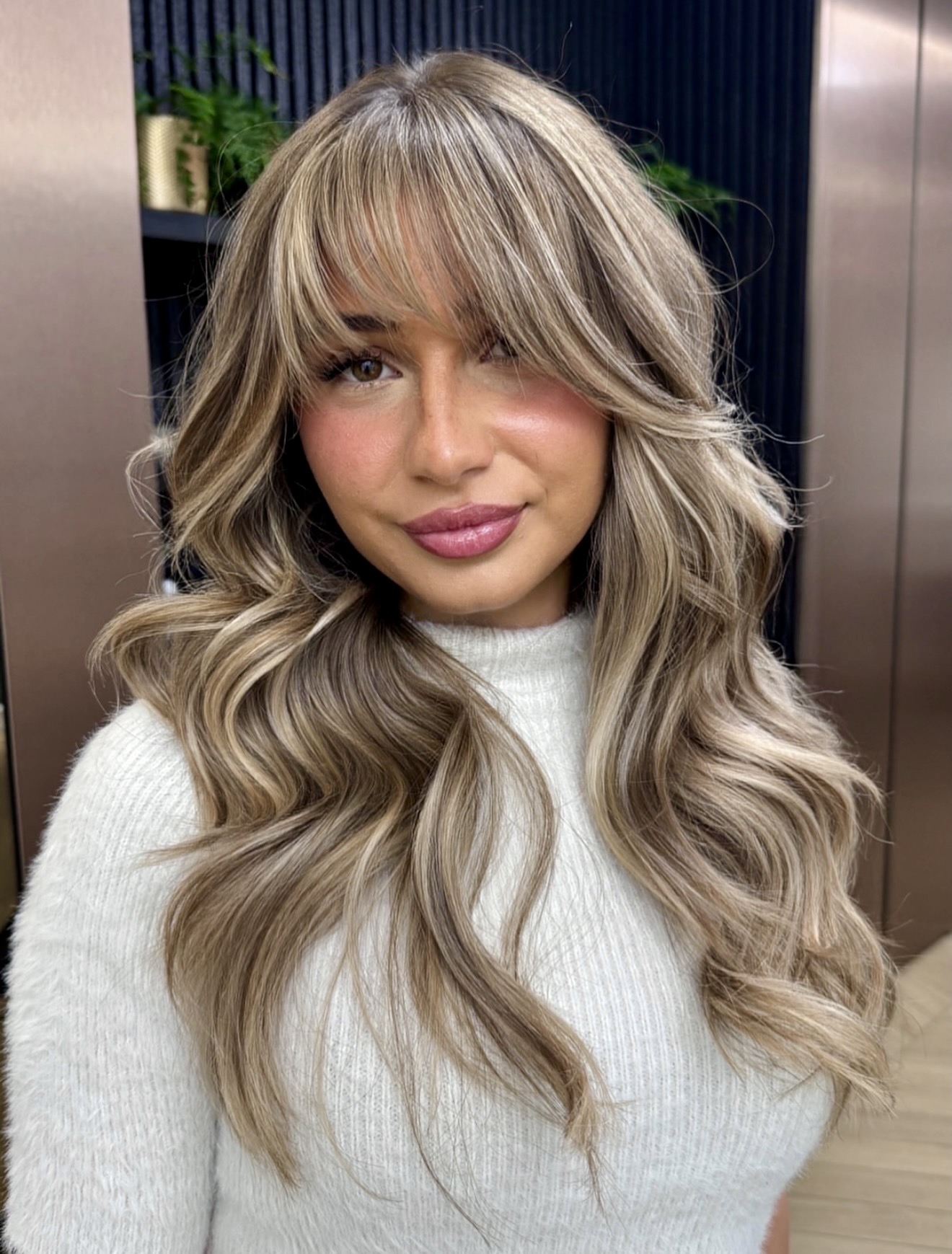 Soften Your Look With Honey Blonde Curtain Bangs