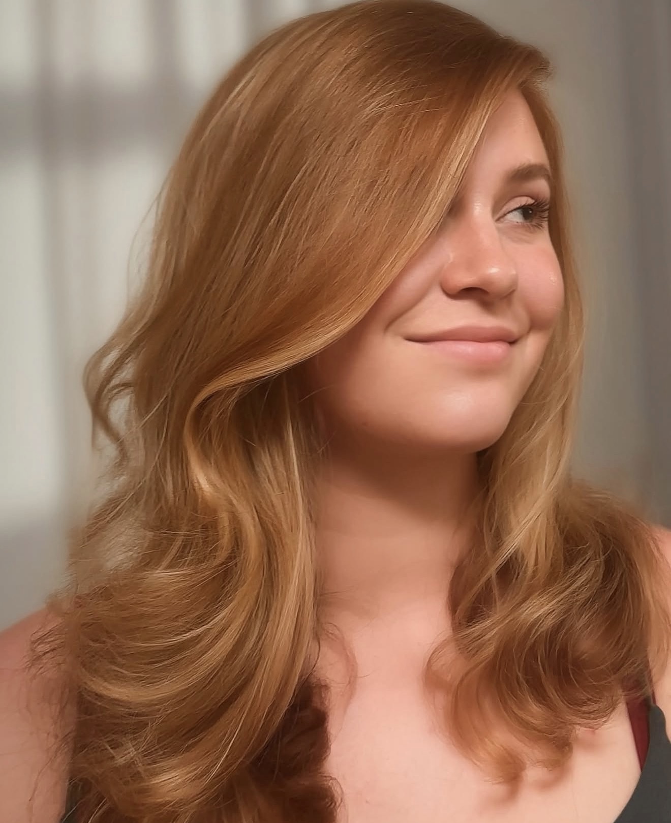 Strawberry Blonde Waves With Face-Framing Layers