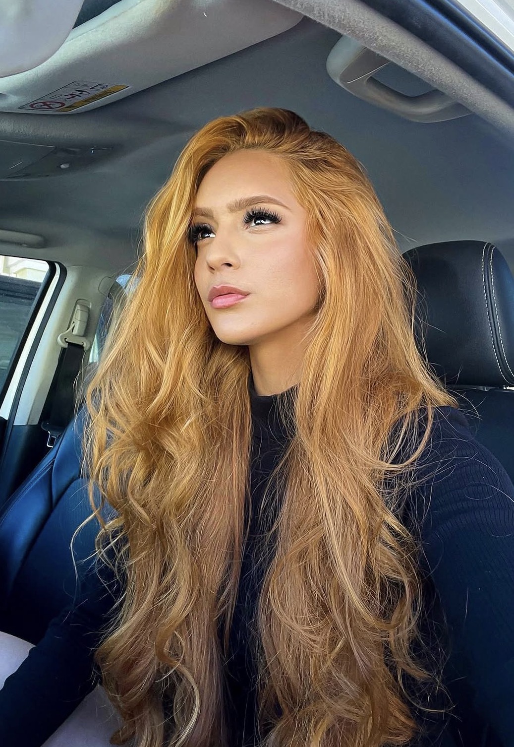 Strawberry Blonde Waves With Face-Framing Layers