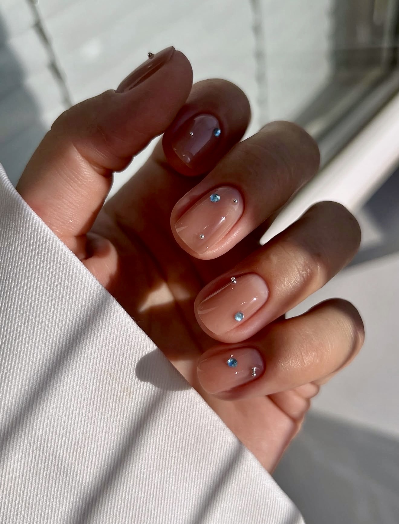 Subtle Gem Accent Nude Glossy Nails