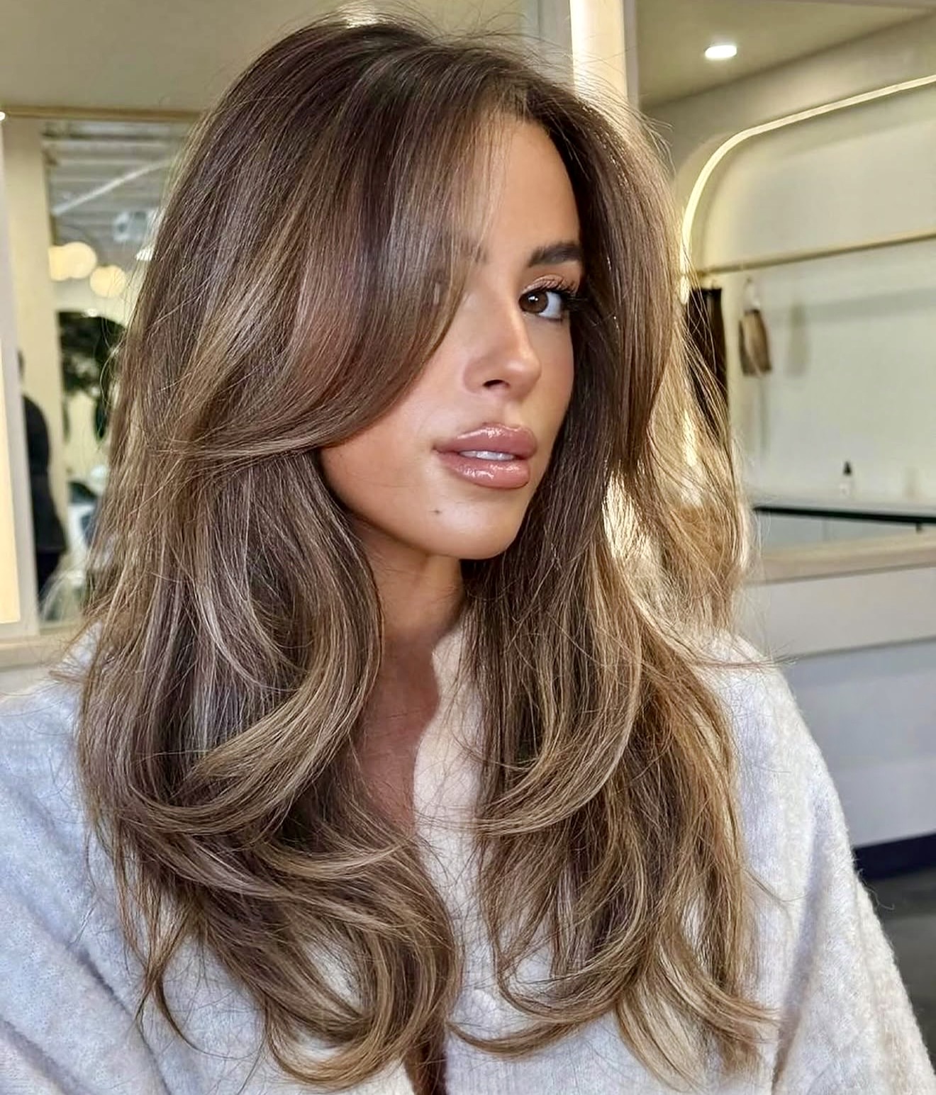 Sun-Kissed Bronde Layers With Face-Framing Bangs
