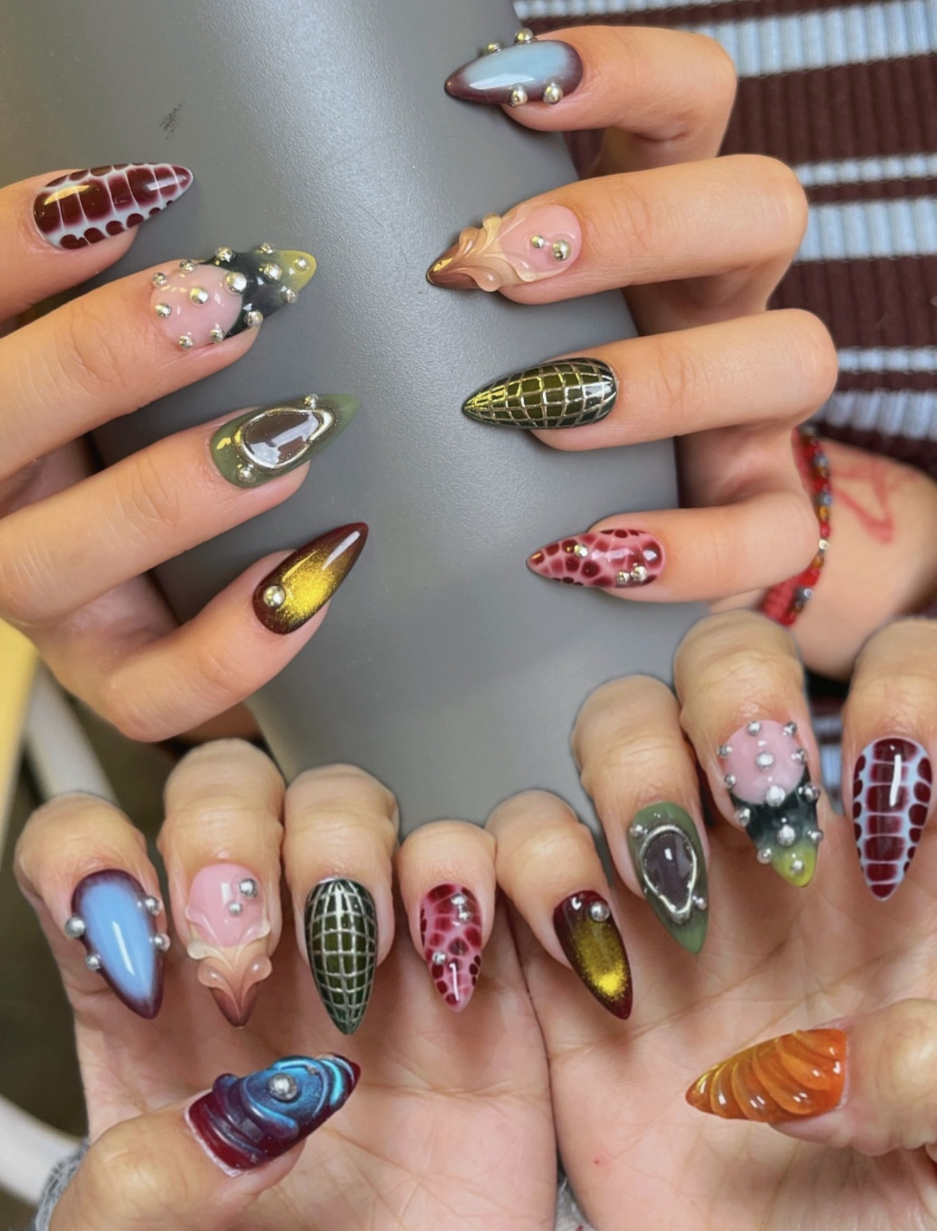 Textured 3D Chrome And Jewel Accented Stiletto Nails