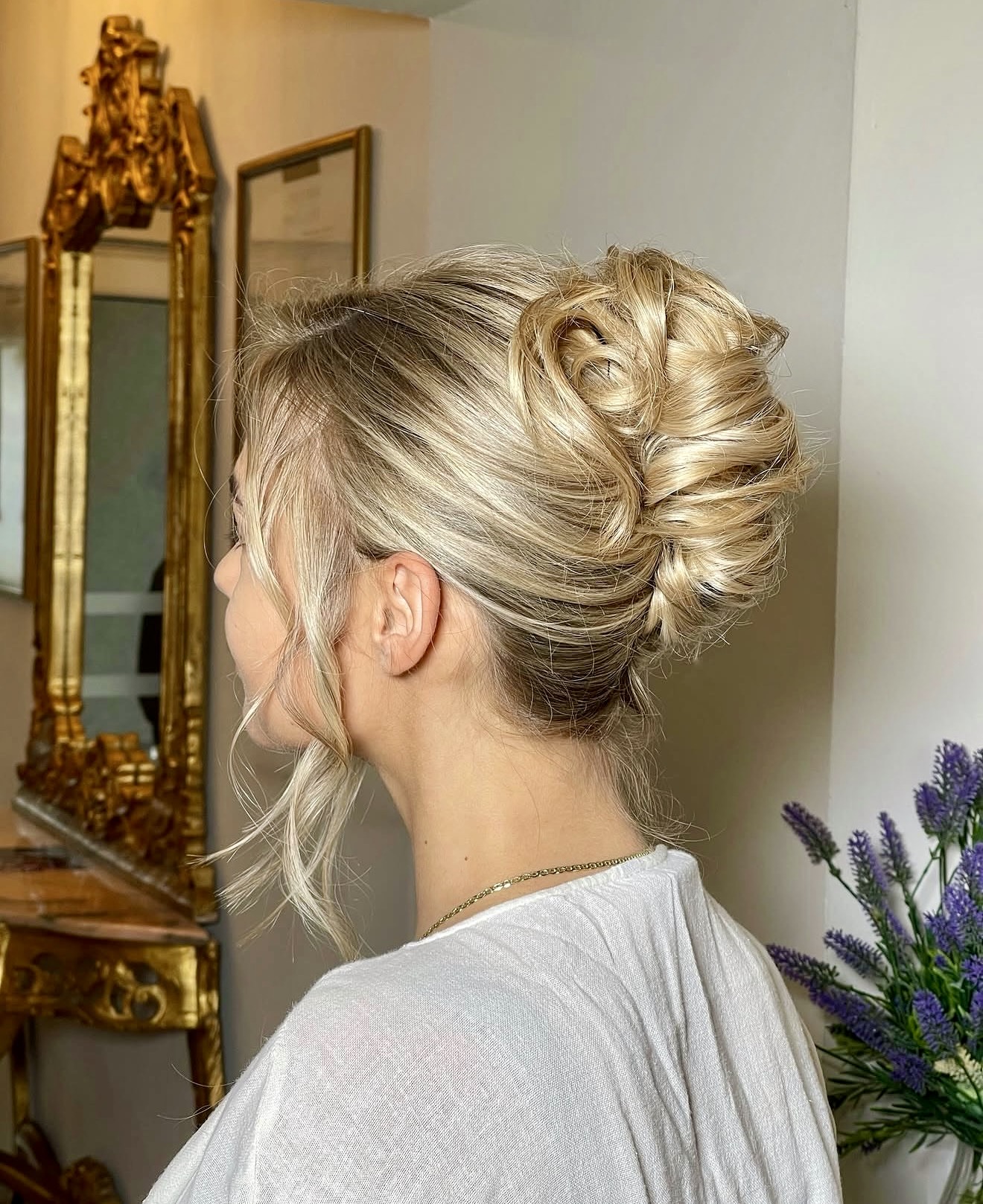 Textured French Roll Updo With Wispy Face-Framing Pieces
