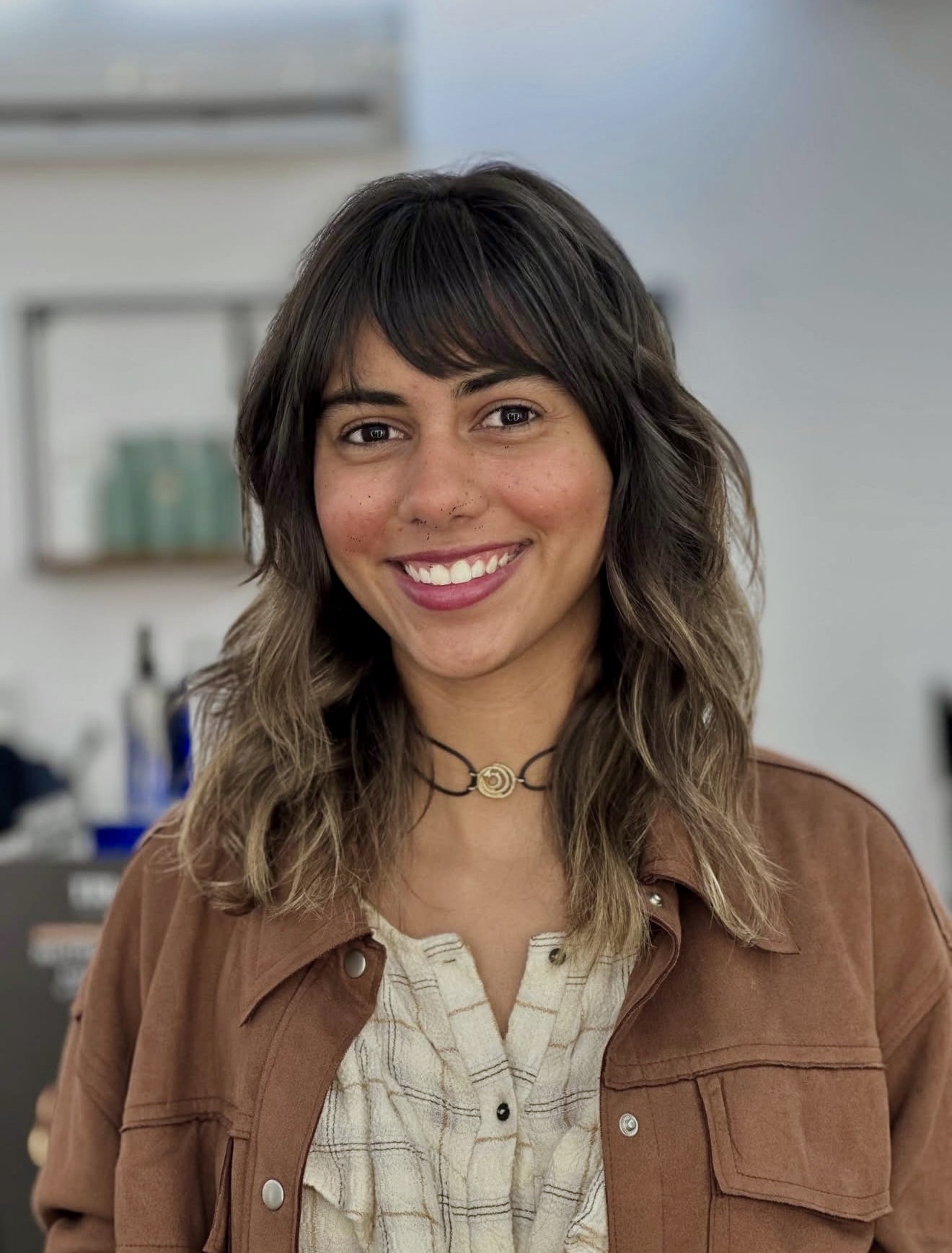Textured Mid-Length Wolf Cut With Wispy Bangs