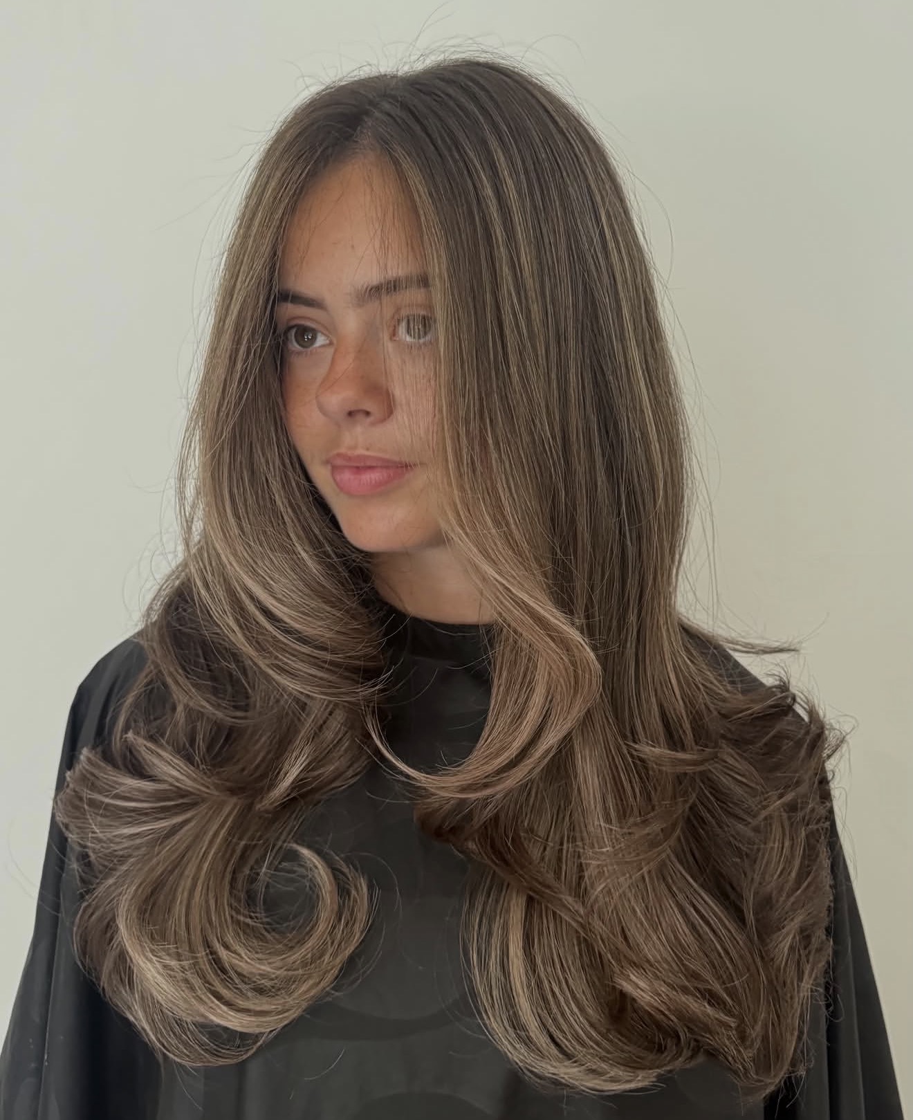 Tousled Brunette Waves With Caramel Highlights