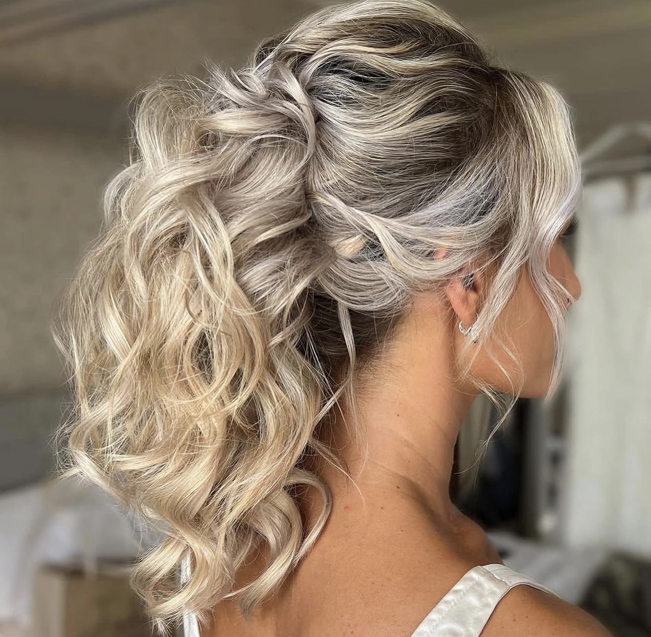 Tousled Dirty Blonde Chignon With Loose Waves