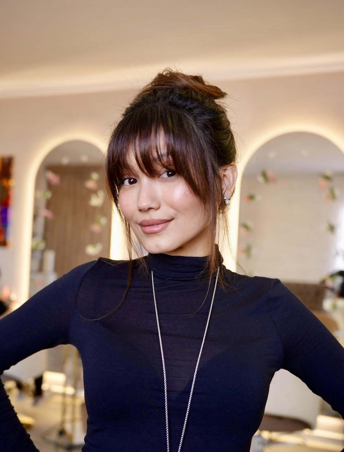 Tousled High Bun With Wispy Bangs