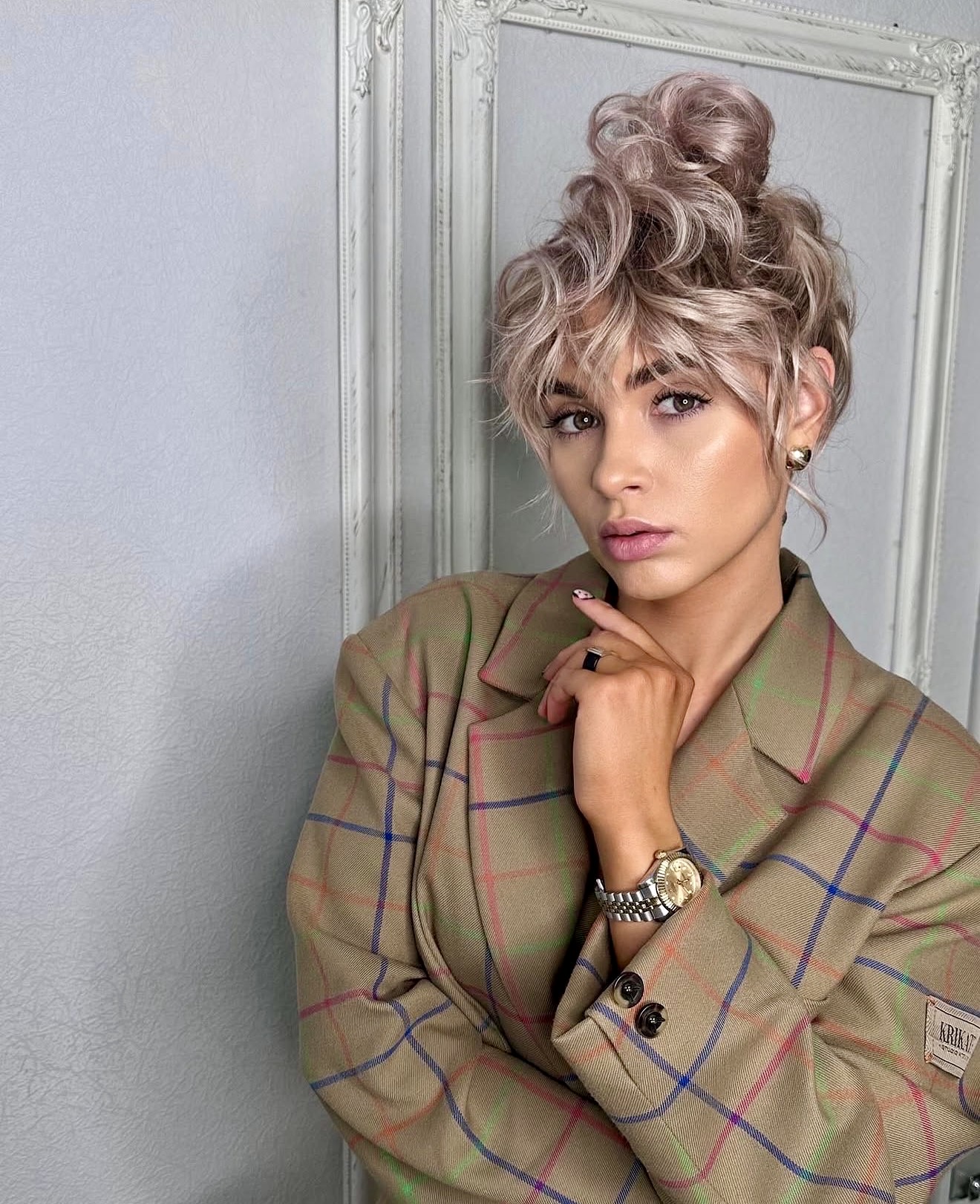 Tousled High Bun With Wispy Curtain Bangs