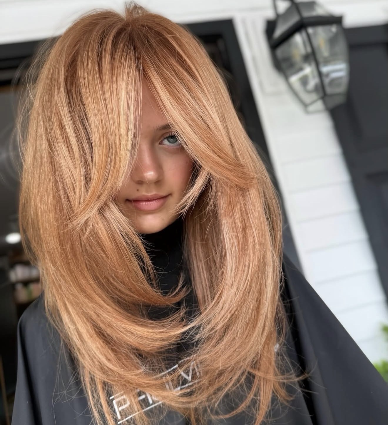 Tousled Peach Blonde Butterfly Cut With Curtain Bangs