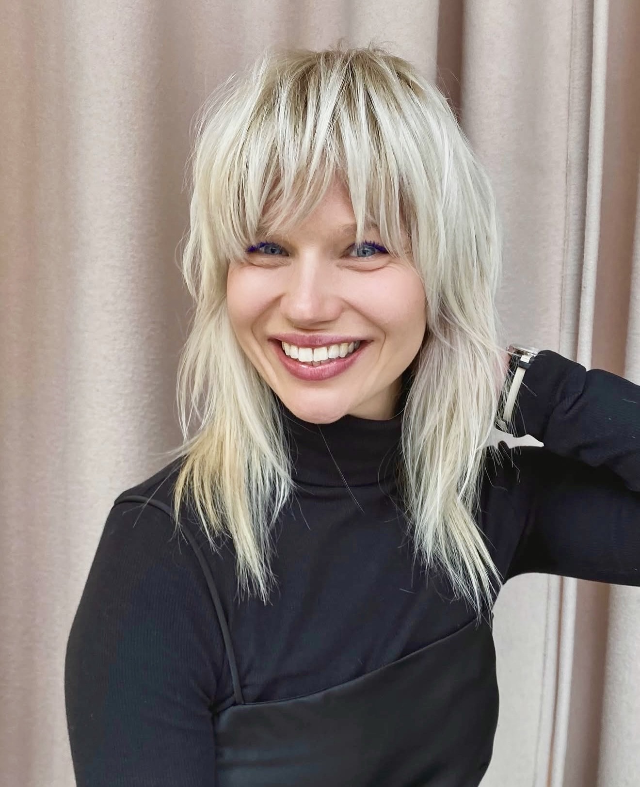 Tousled Platinum Blonde Wolf Cut With Wispy Bangs