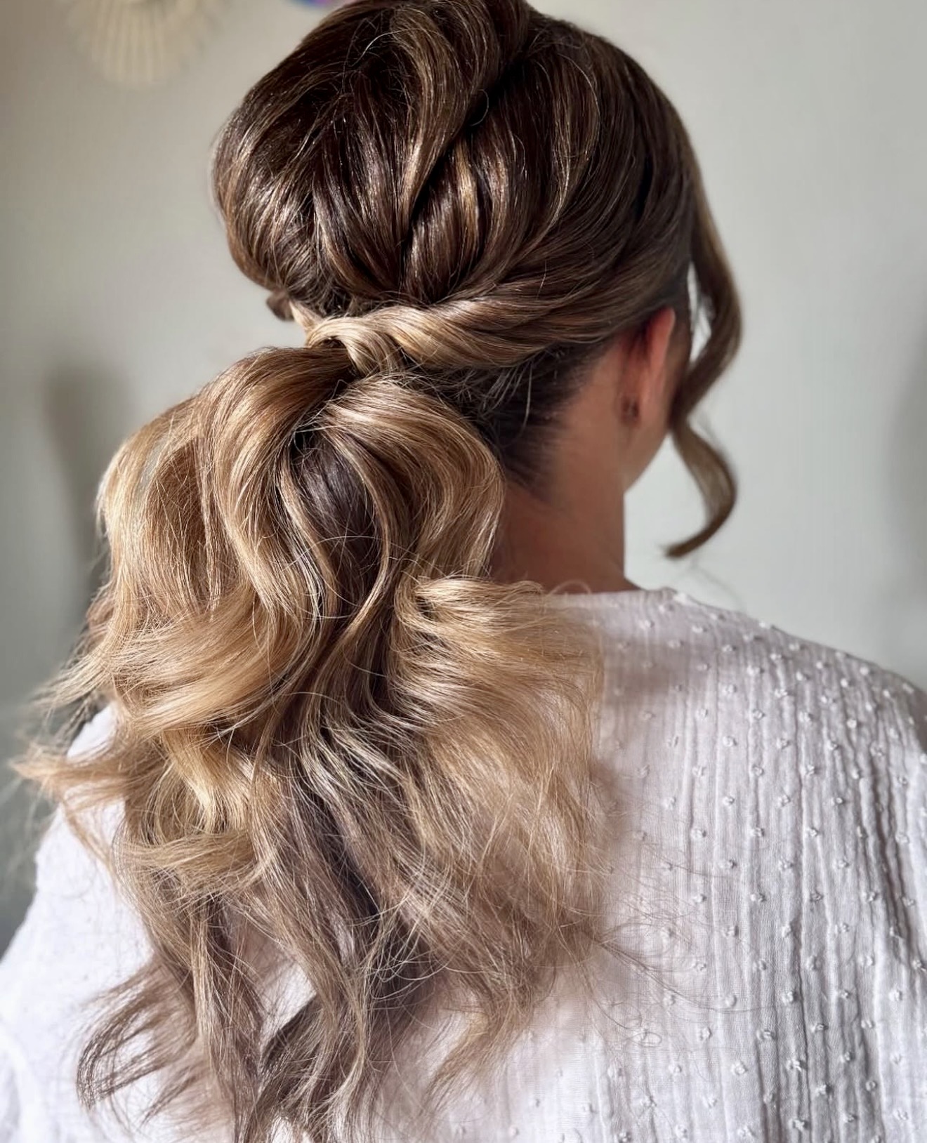 Twisted High Ponytail With Loose Waves
