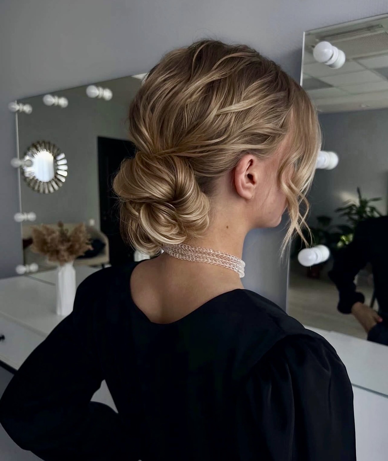 Twisted Low Bun With Wispy Face-Framing Strands