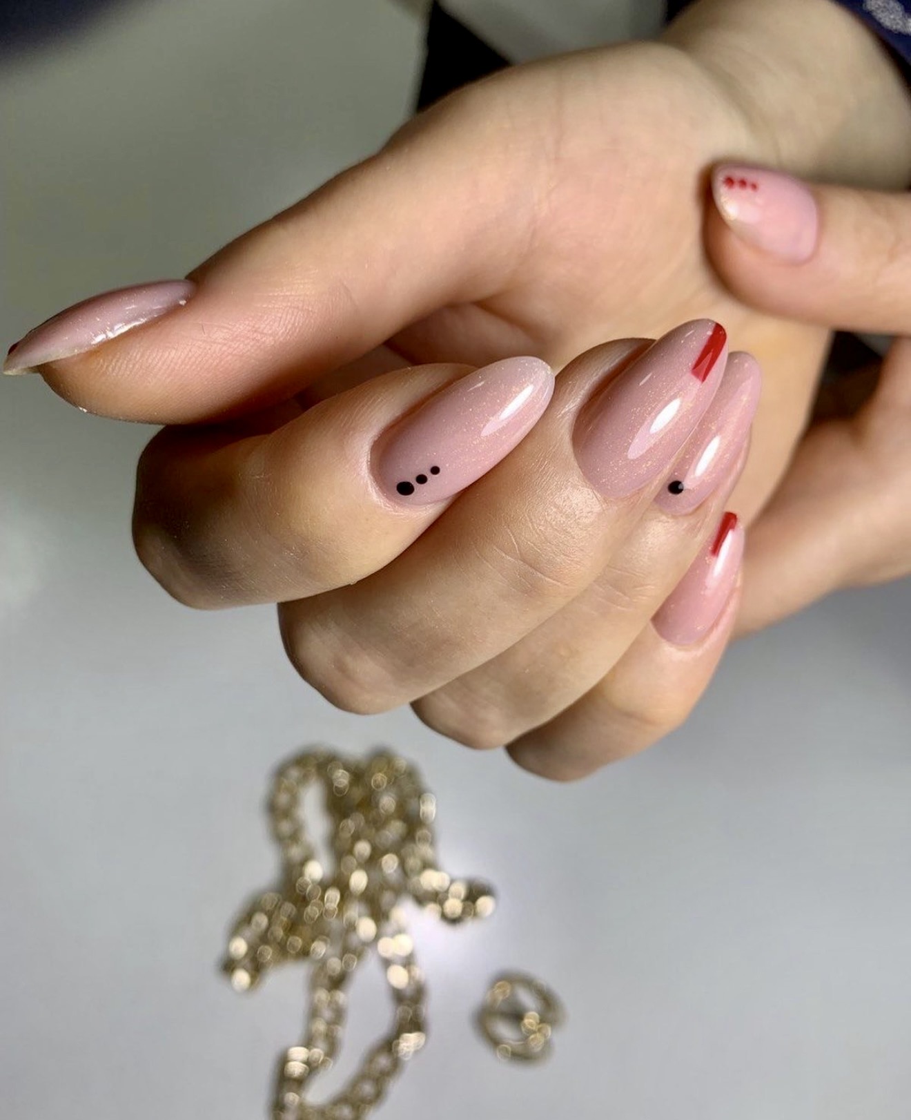 Understated Pink Glitter Almond Nails with Minimalist Art
