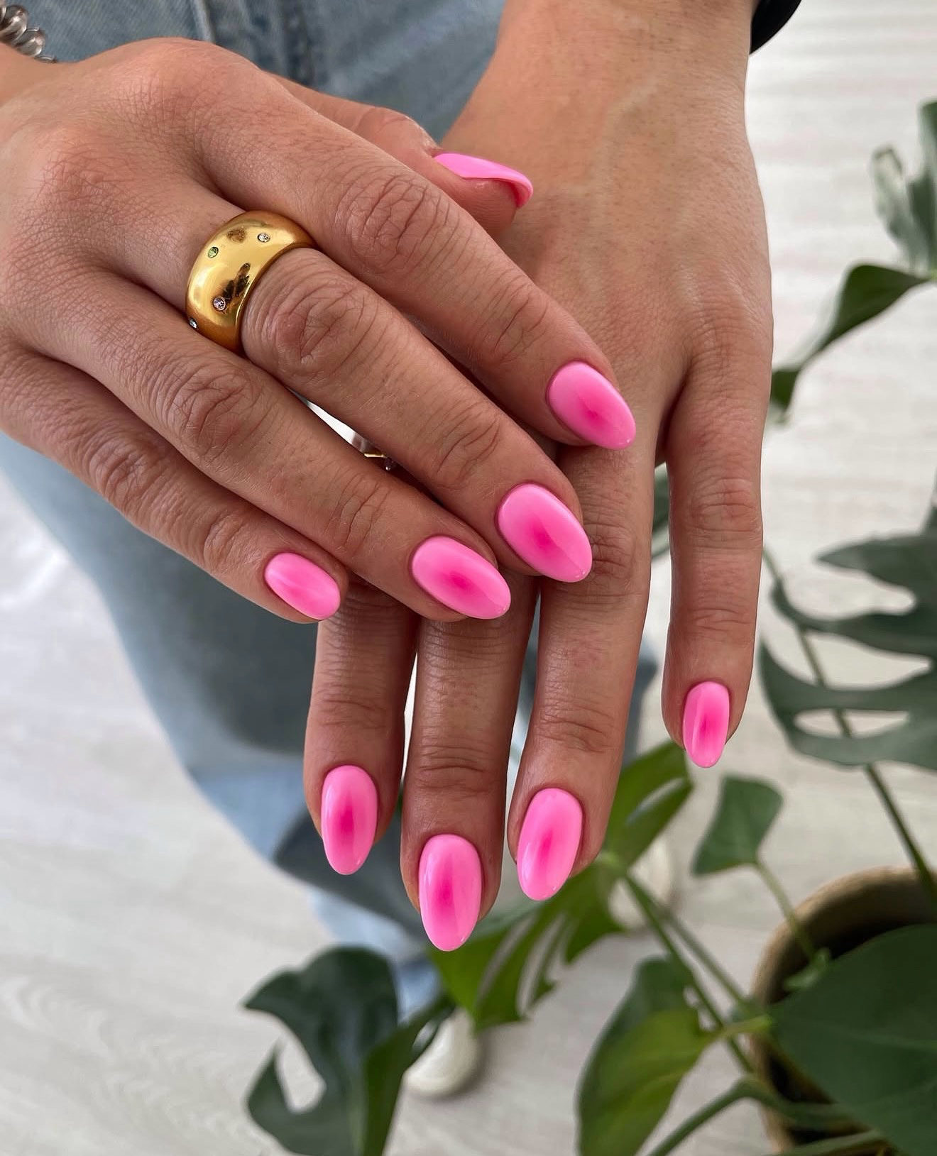 Vibrant Neon Pink Aura Almond Nails
