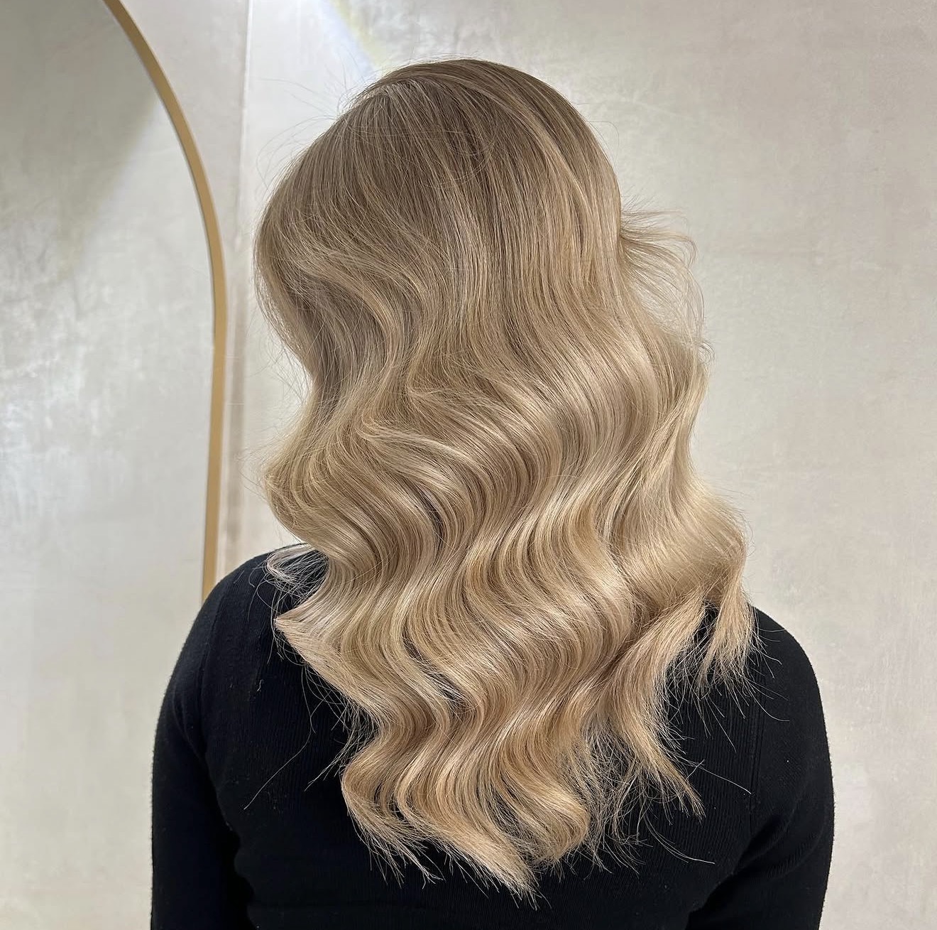 Voluminous Dirty Blonde Waves with Lived-In Color