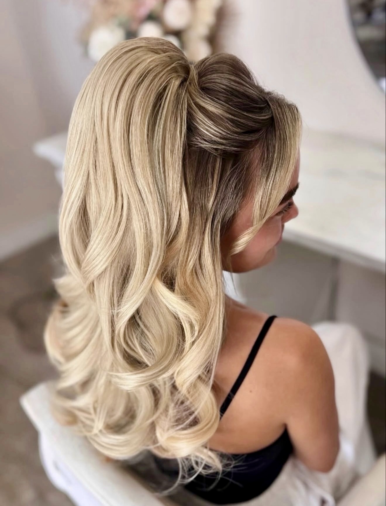 Voluminous High Ponytail With Face-Framing Waves