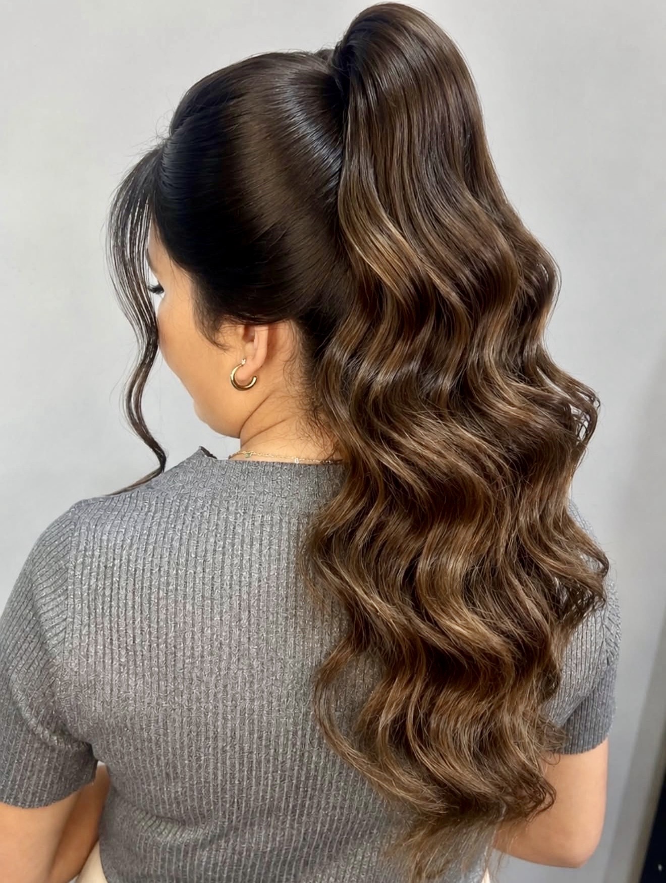 Voluminous High Ponytail With Glamorous Waves