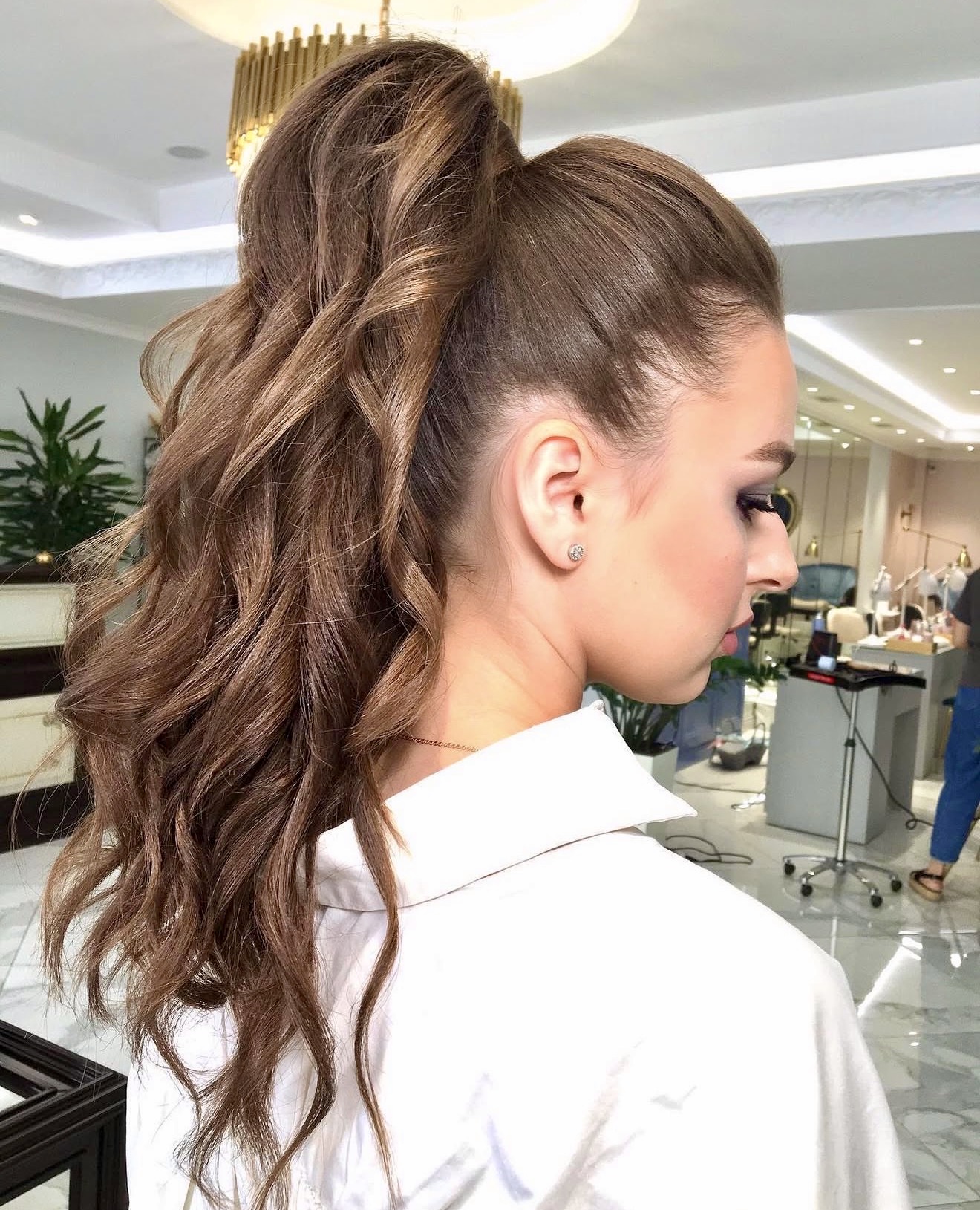 Voluminous High Ponytail With Loose Waves