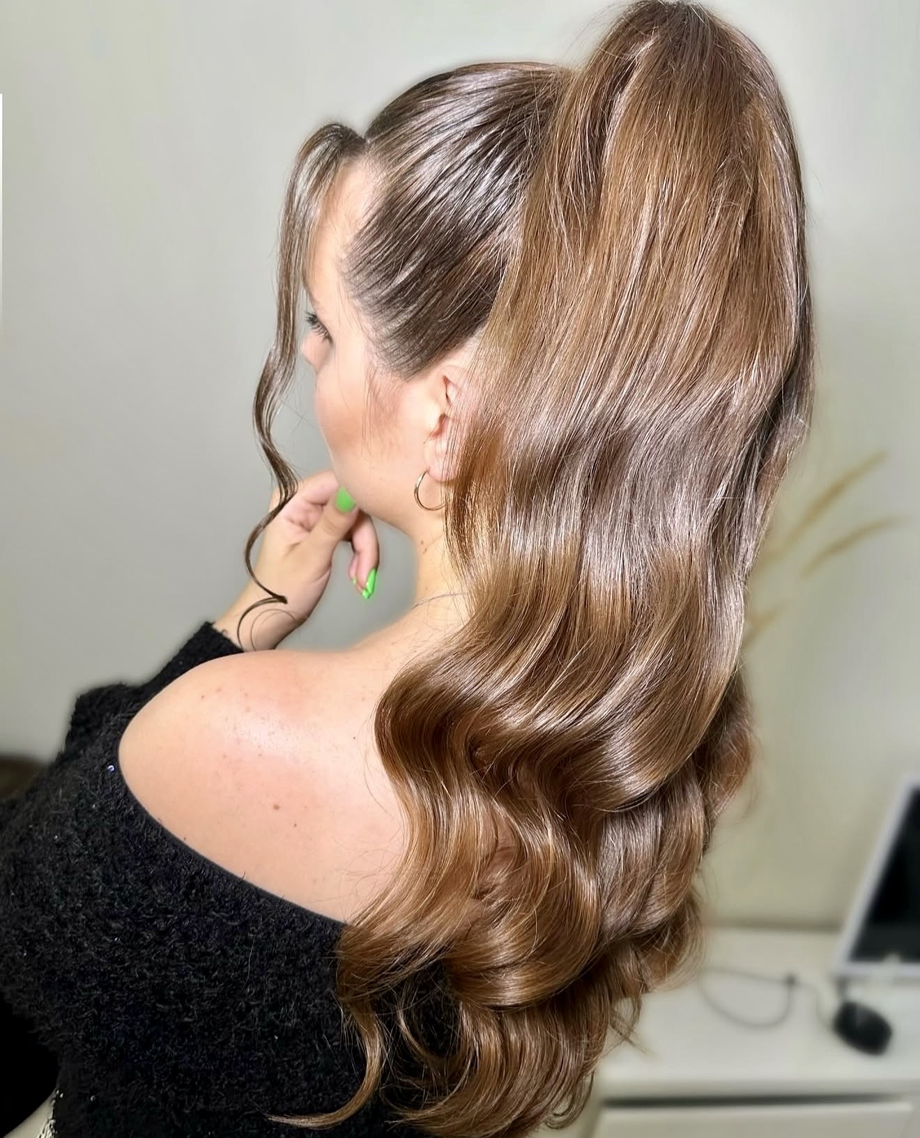 Voluminous High Ponytail With Wispy Face-Framing Pieces