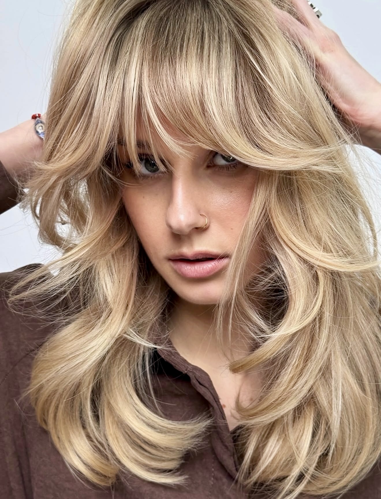 Voluminous Honey Blonde Curtain Bangs Blowout