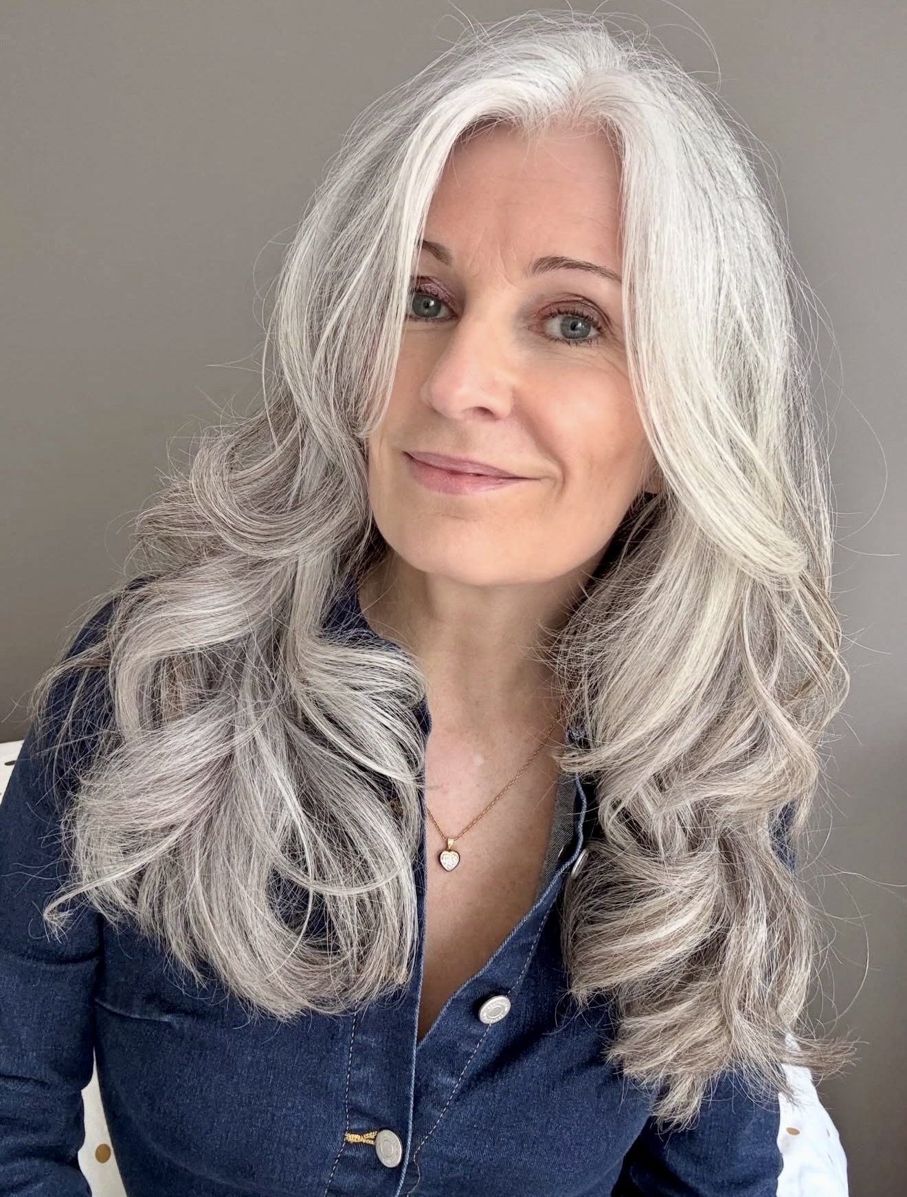 Voluminous Silver Curls With Face-Framing Layers
