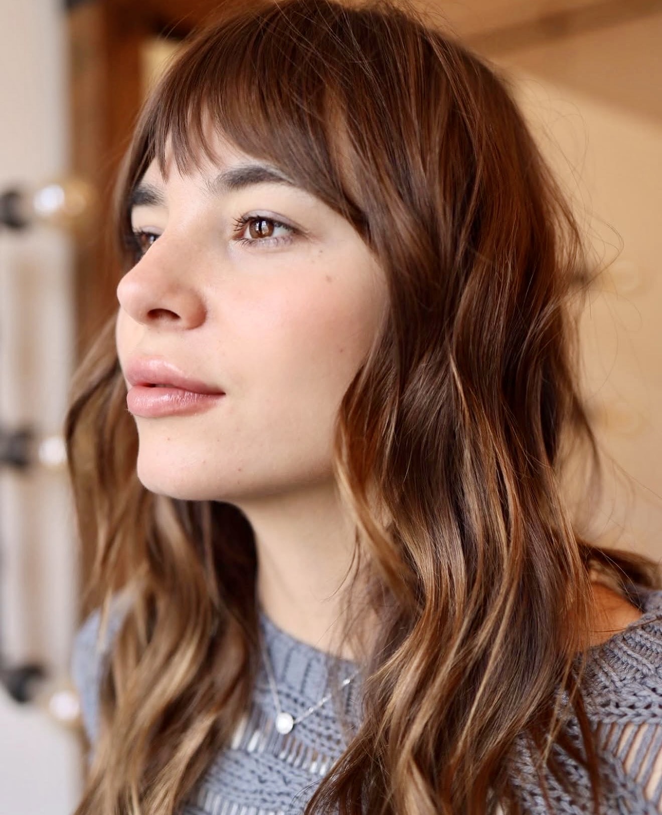 Warm Bronde Waves With Wispy Curtain Bangs