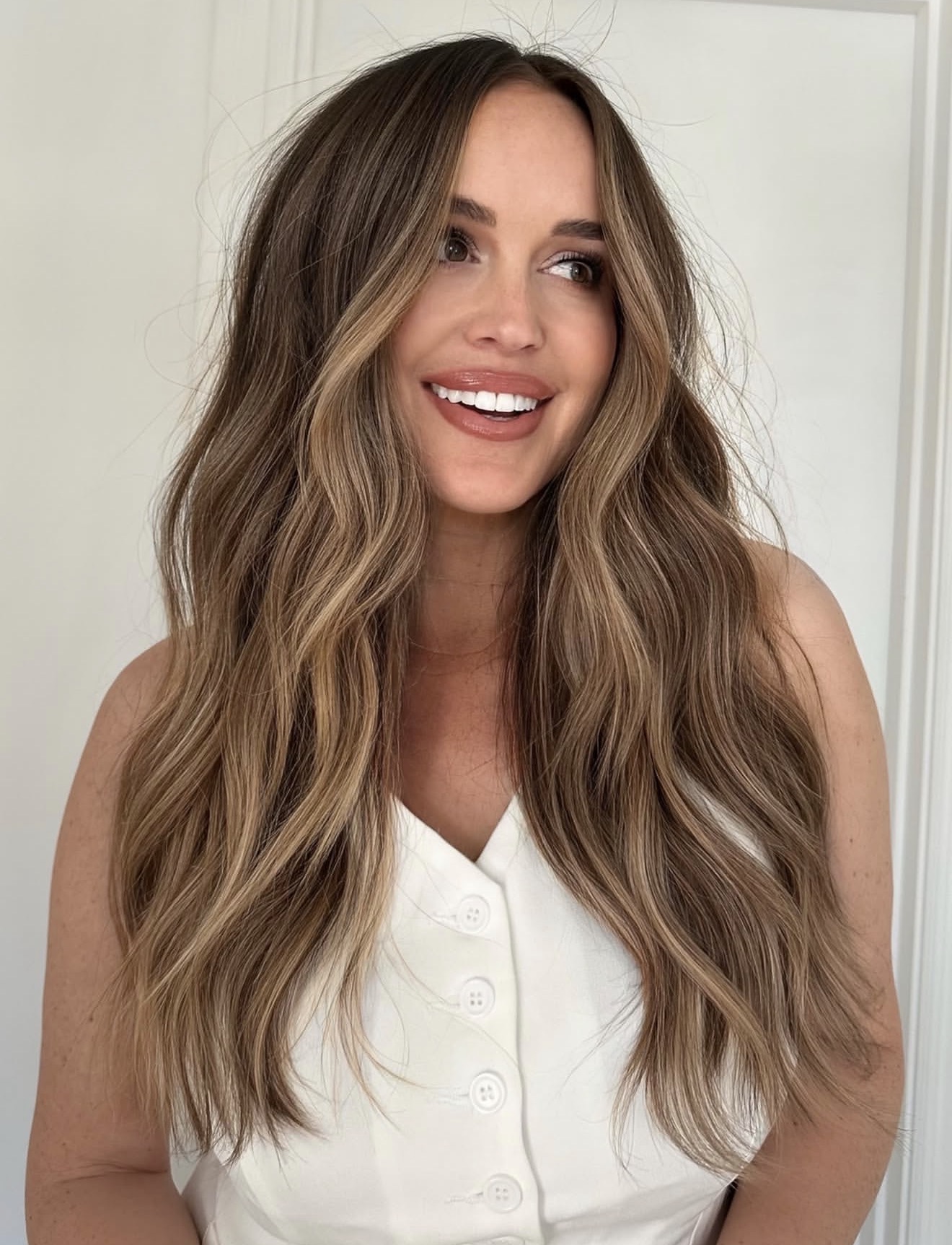 Warm Honey Balayage On Long Tousled Waves
