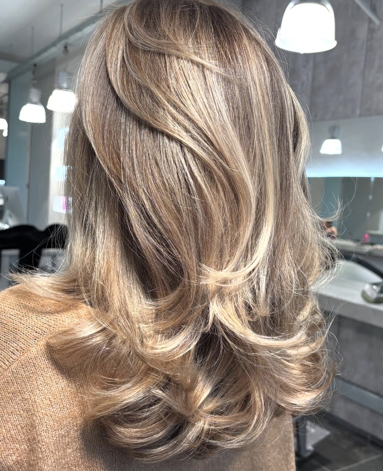Warm Honey Blonde Layers With Loose Waves